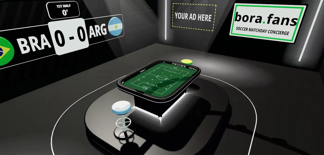 De e-sportszaal, met de tafel onder de lampen